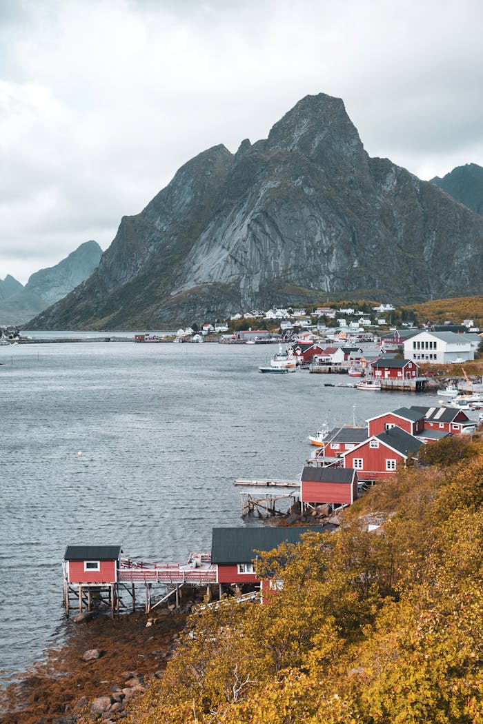 The Art of Drawing Readers In: Your attractive post title goes here Scenic view of Reine village with Olstinden mountain and fjord in Lofoten, Norway.